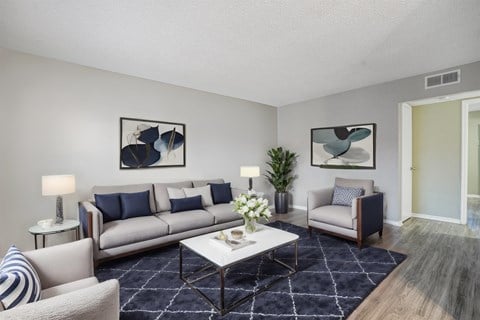 our apartments offer a living room with couches and a coffee table