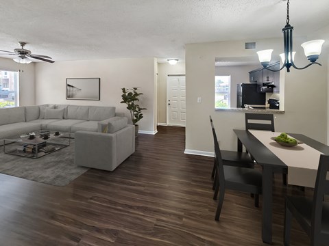 a living room and dining room with a couch and a table