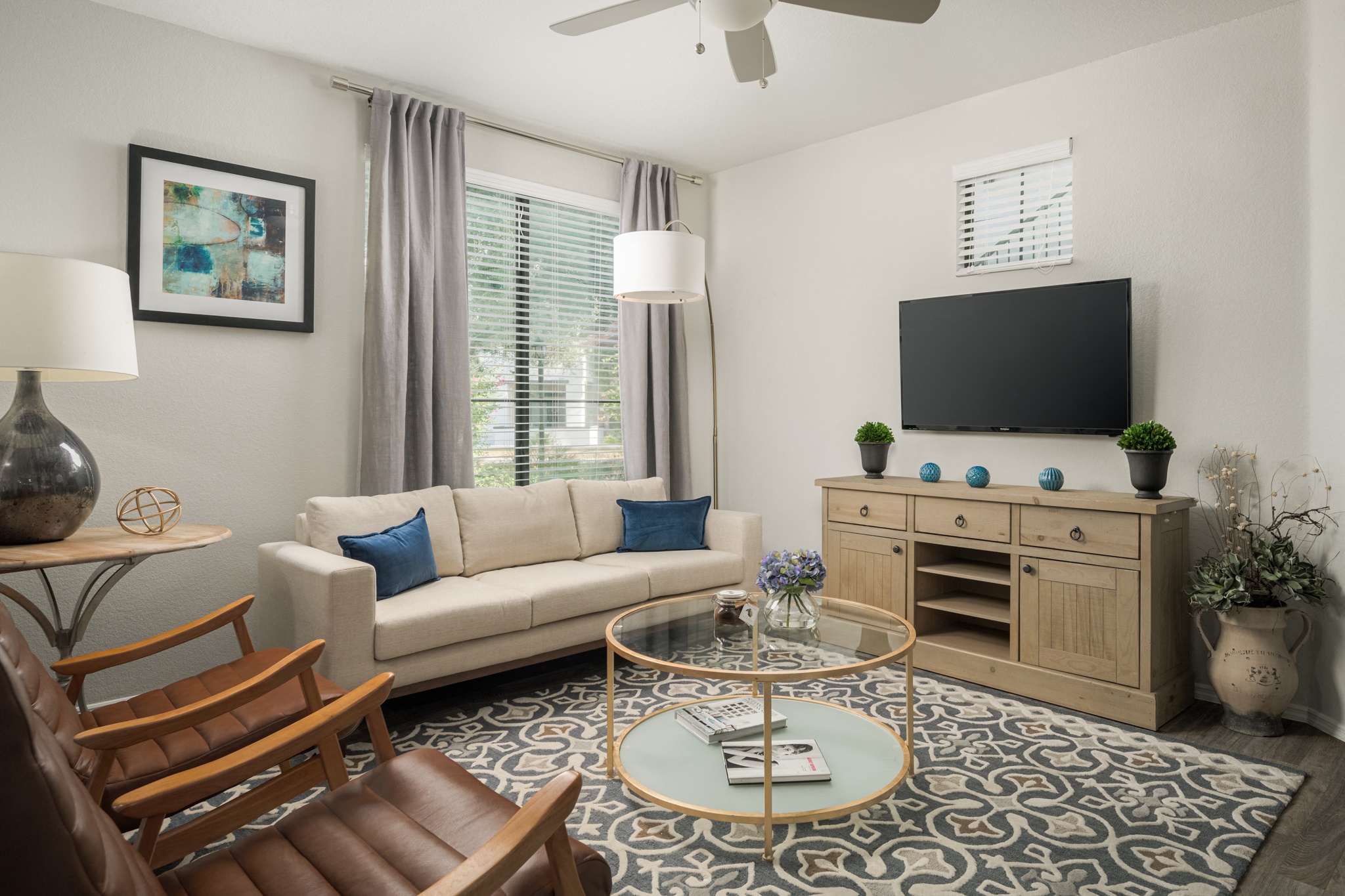 a living room with a couch and a table and a television