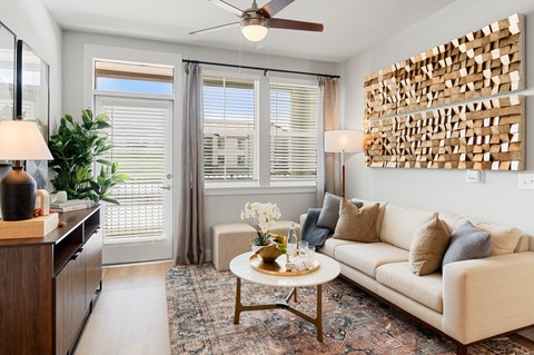 a living room with a white couch and a coffee table