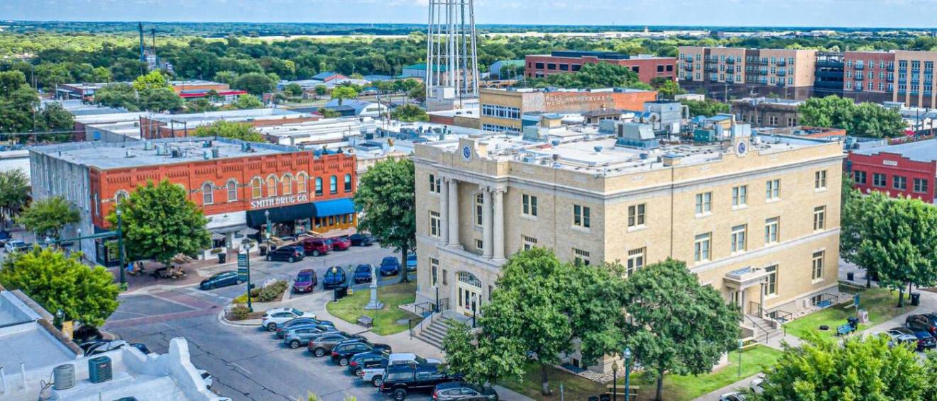View of downtown McKinney, TX, number one of best cities for renters in 2025, during sunrise in summer.
