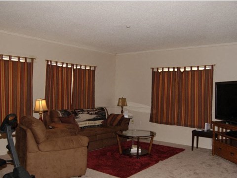 a living room with two couches and a table