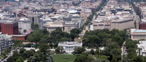 A picturesque view of the White House in Washington, D.C., surrounded by lush greenery and iconic landmarks.