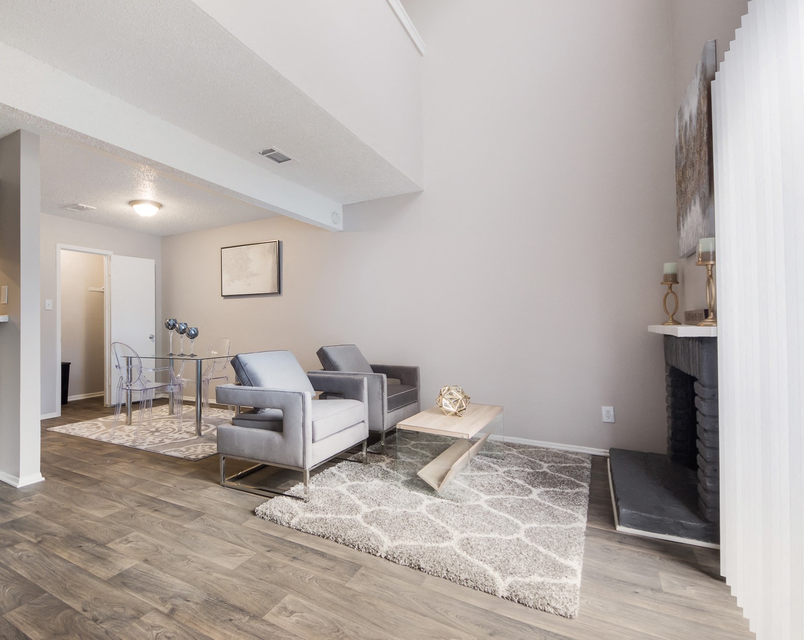 a living room with a couch and a chair and a table